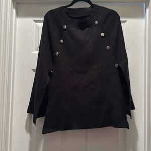 Black cape with silver buttons. One size fits most